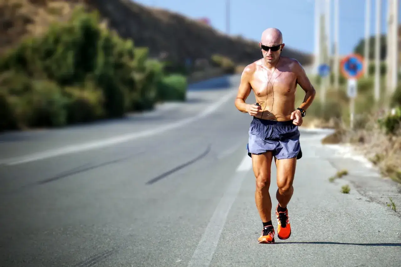 man running a 5k on road